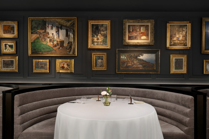 a table with a white tablecloth and a vase of flowers on it