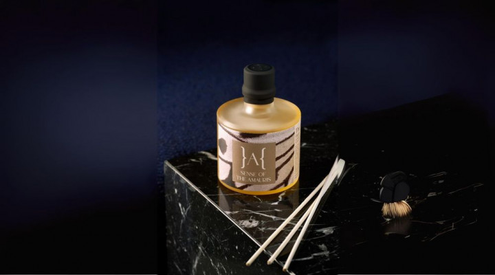 tle of liquid room scent on a marble surface